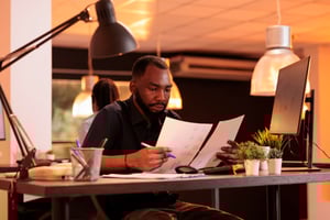 african-american-worker-taking-notes-about-contract-report-analyzing-paperwork-with-business-data-office-working-with-documents-research-find-executive-solutions