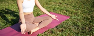body-woman-meditating-park-enjoying-sun-beams-her-skin-relaxing-fitness-training