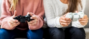 women-playing-video-game-together